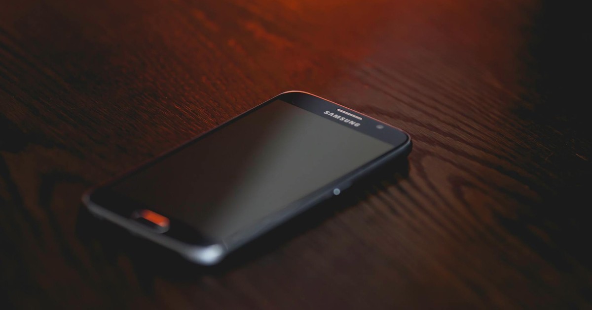 Smartphone on a dark wooden surface