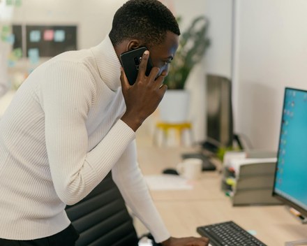 Person sitting calmly with phone face down on table