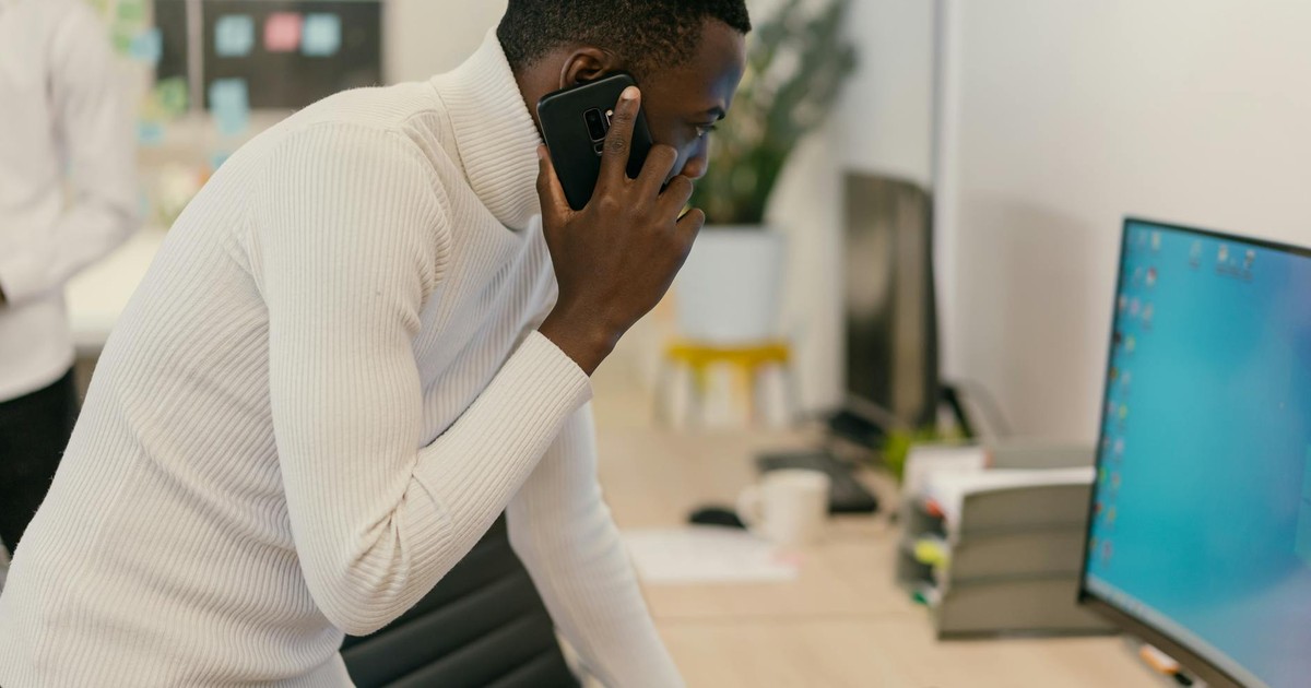 Person sitting calmly with phone face down on table