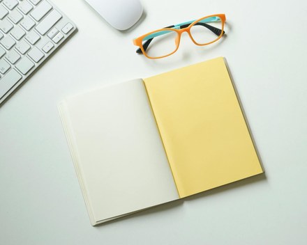 Open notebook with a single short list, calm desk
